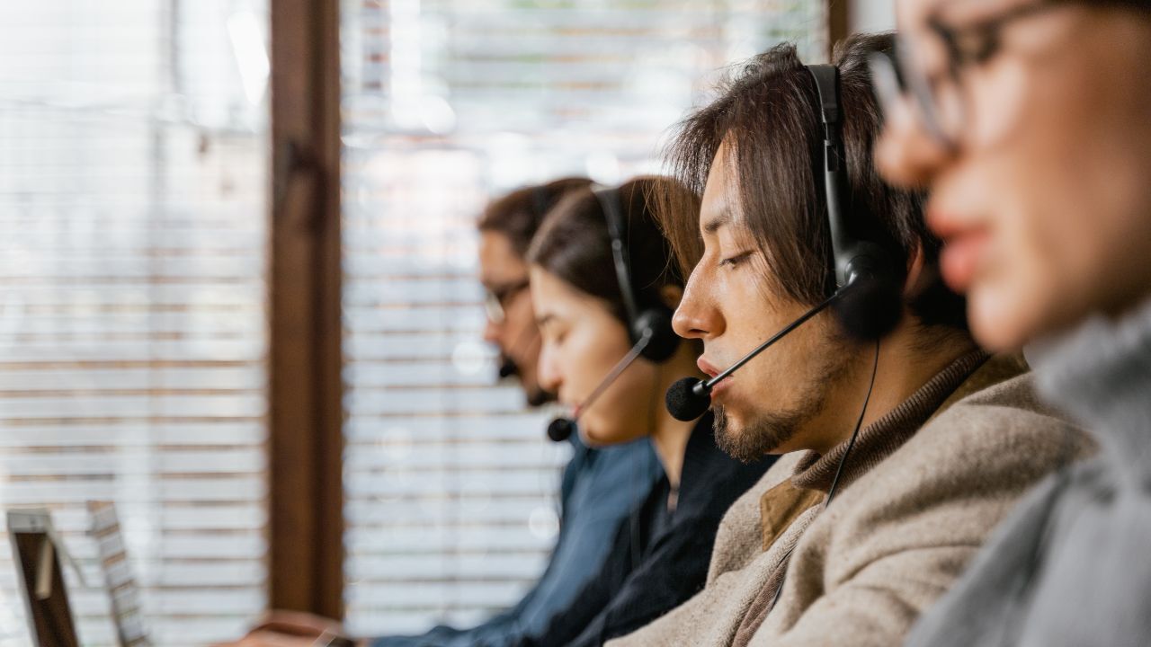 Three people working in a contact centre