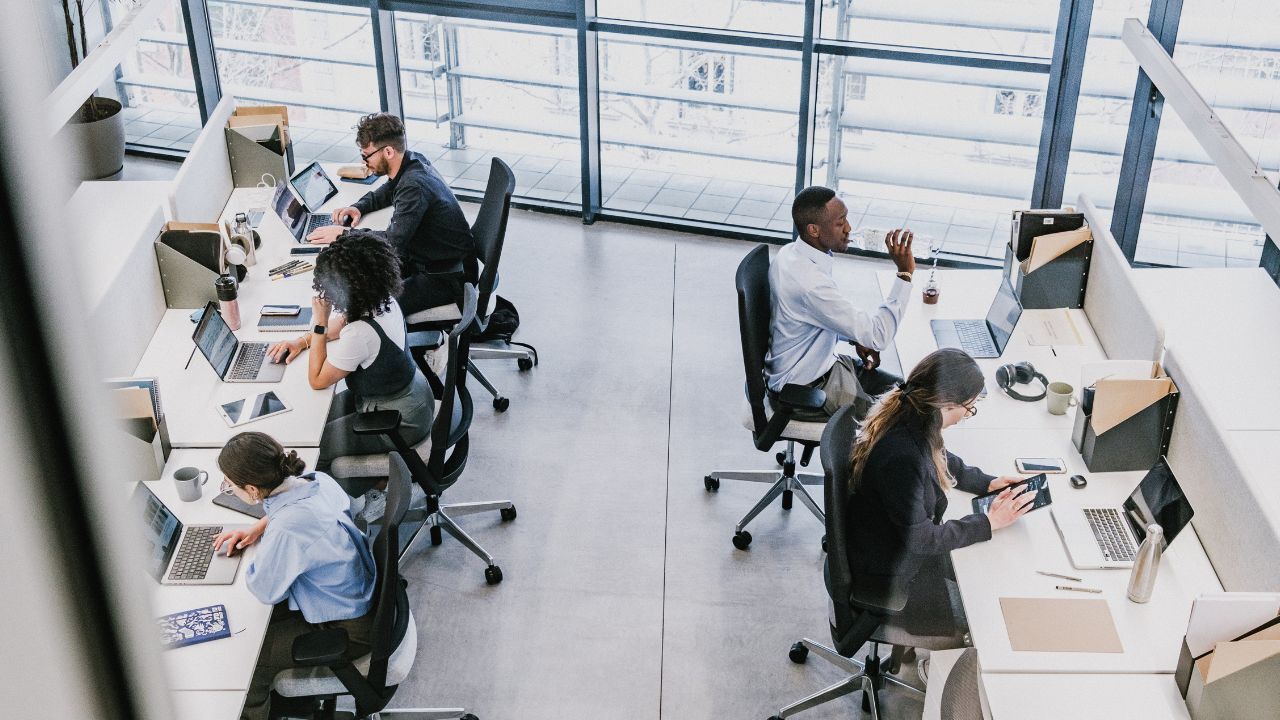 A group of people working in a customer service office